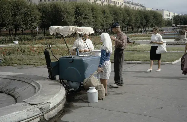 Russia, people buying drinks from vendor in Khabarovsk