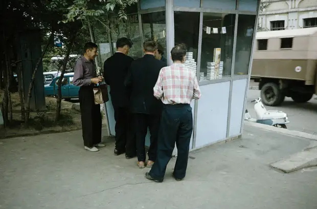 Russia, men purchasing from tobacco stand in Khabarovsk