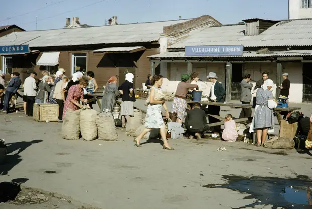 Russia, people gathered at street market. Siberia